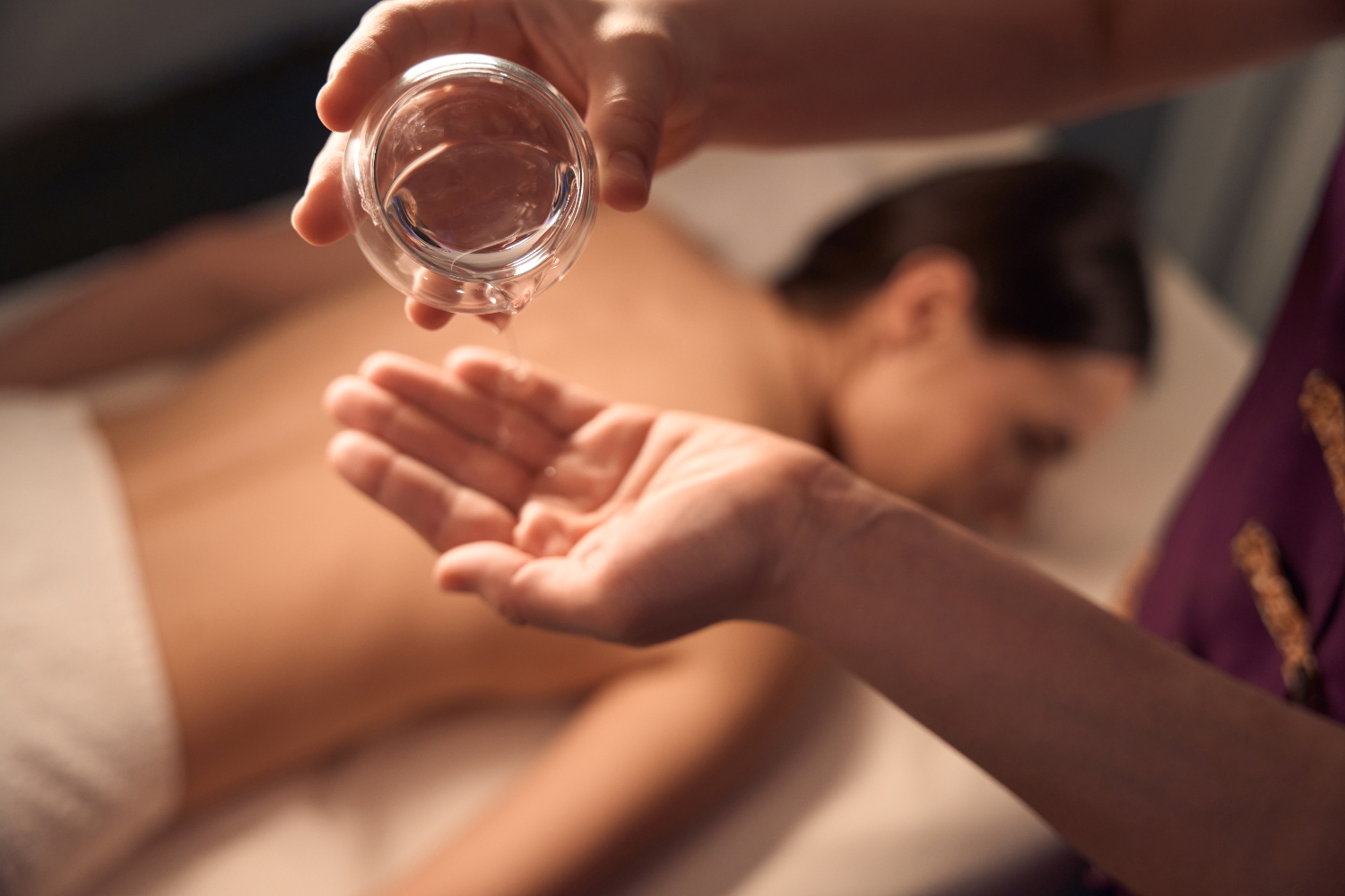 Aromatherapy oil massage in a calm spa setting